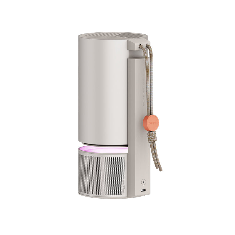 XGIMI MoGo 3 Pro portable projector, tilted on its integrated stand with the lens illuminated